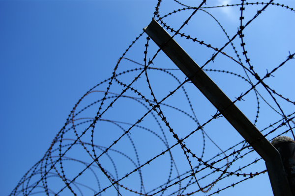 Home Secure perimeter wall and fence protecting a commercial property